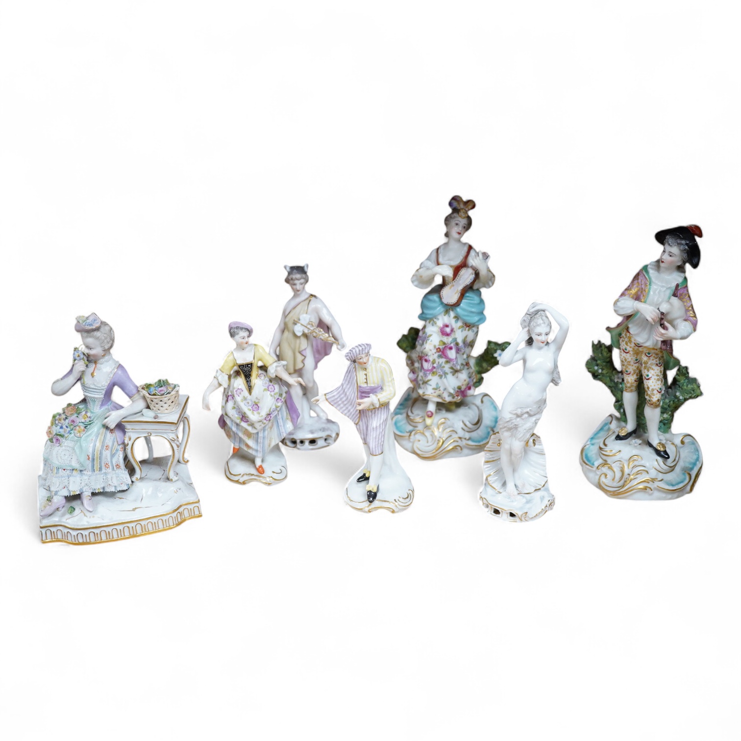 A Meissen seated figure emblematic of sense of smell, and three pairs of Continental porcelain figures, (7) tallest 19cm.